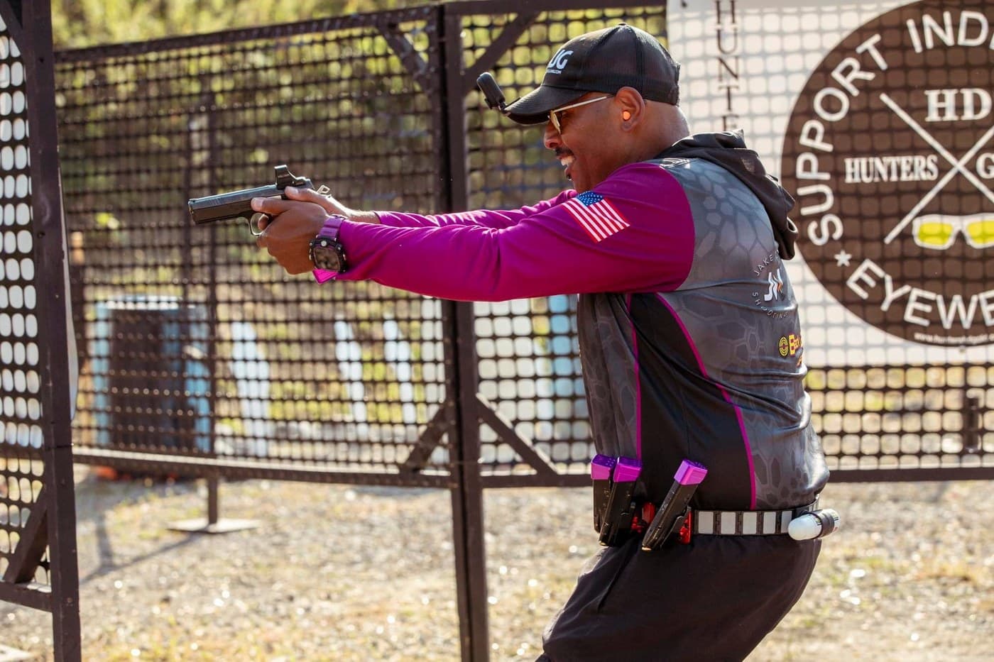 Marlo Odus shooting on the move at a USPSA match